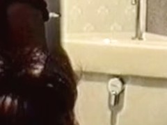 Toilet cam records amateur rubbing pussy through panty