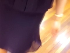 Asian beauty sitting on hunkers and flashing slit up skirt