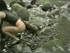 BDSM loving babe enjoys pussy insertions in public