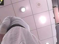 Cute babe with nice legs is filmed on a hidden cam