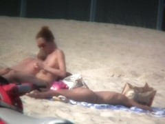 Sexy blonde and naughty brunette on nude beach