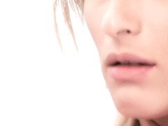 Beautiful blonde babe looks amazing in black stockings and garter belt, while fingering her pussy