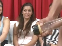 Latino boy demonstrates sextoy for men during cfnm show