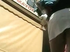 horny upskirt teen show in a white and denim mini skirt