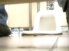 Sitting on hunkers and pissing amateur shows hairy nub