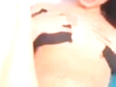 Girl play with her black open front bra