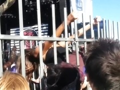 Blonde in the cage is performing erotic strip show in public