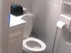 Spy cam in the bath room records nude babe dressing